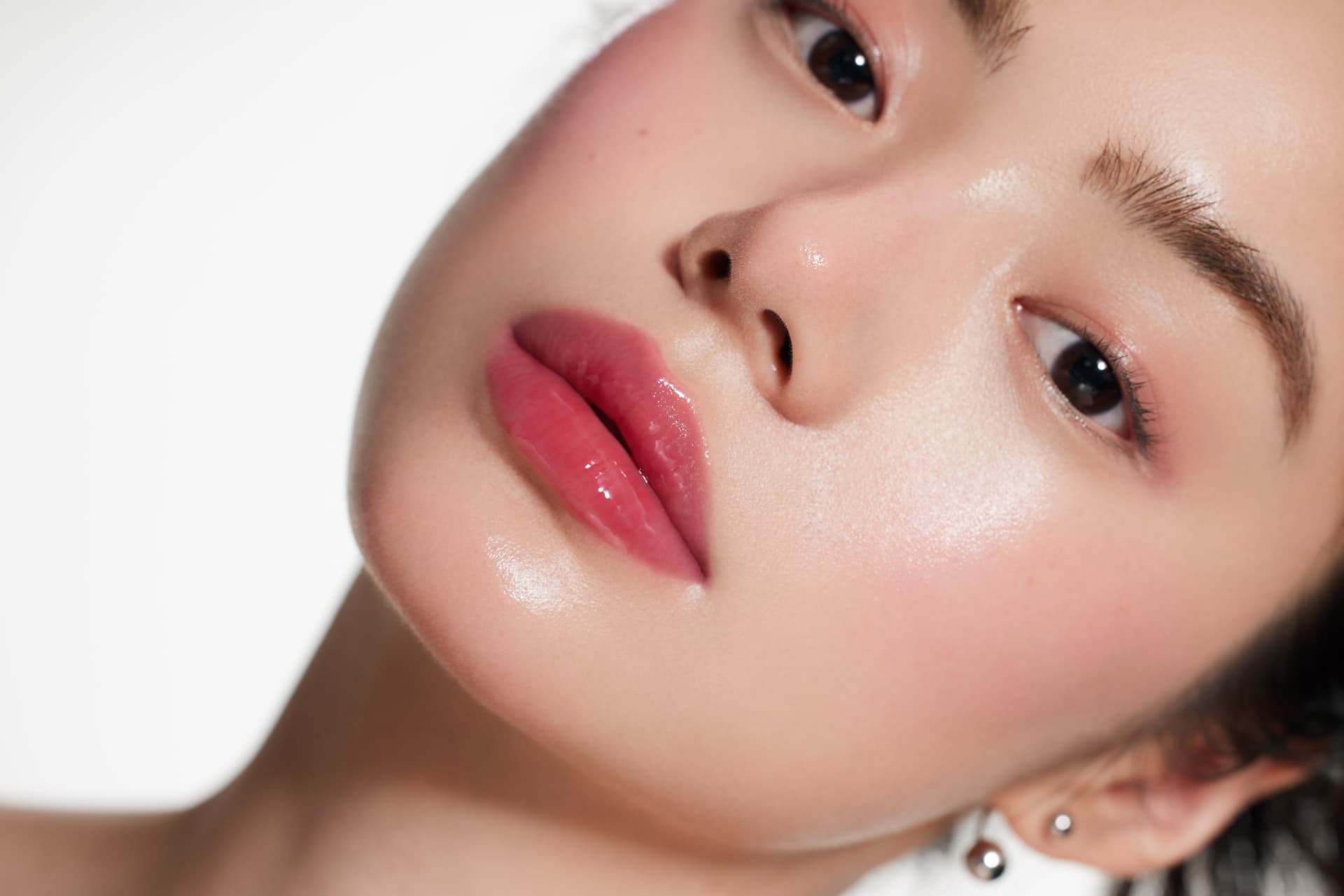 Close-up of luminous, dewy glass skin